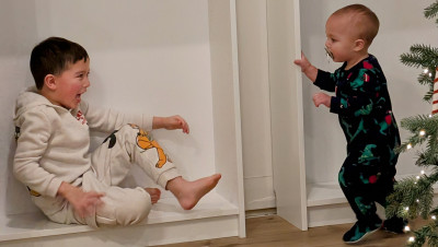 Reece and Trevor playing with the cabinets.